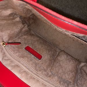 Red Michael Kors handbag